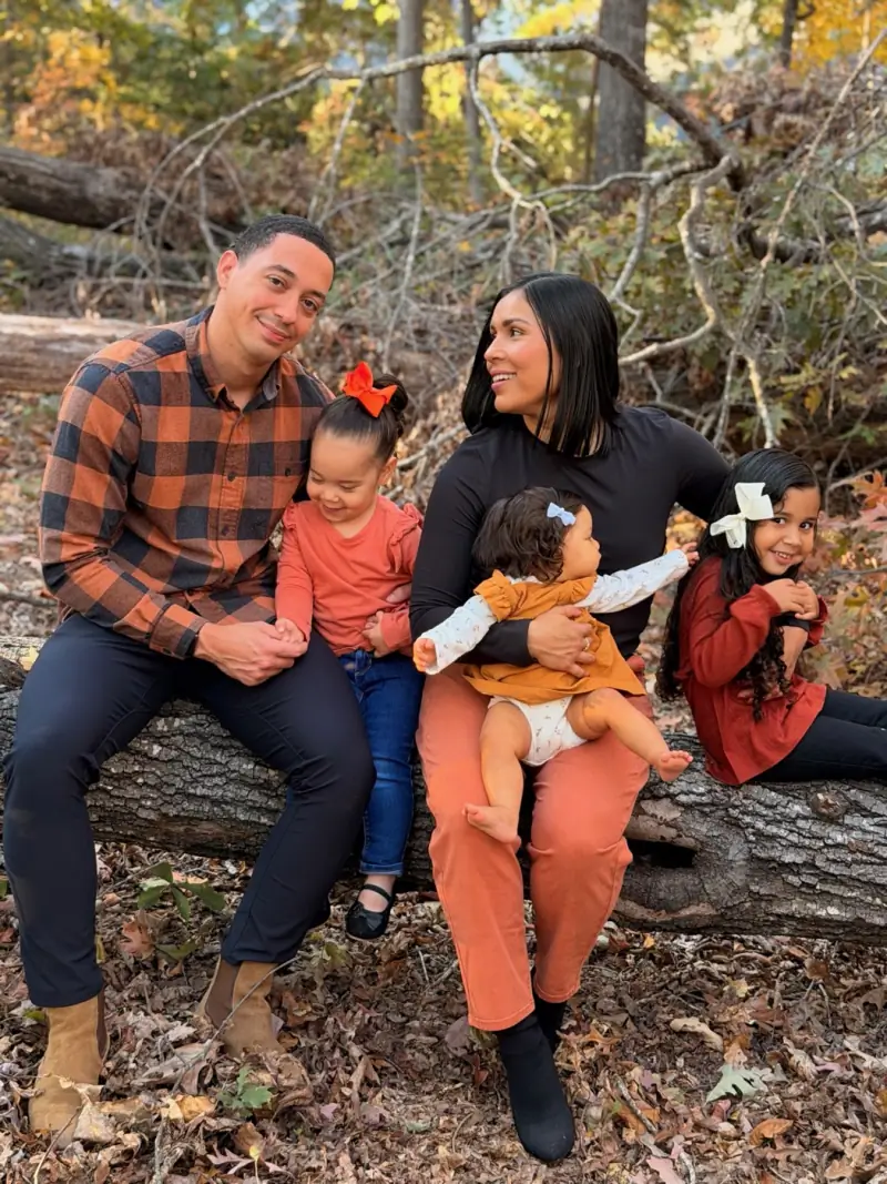 Geoff Bey with his wife and daughters during a fall family portrait